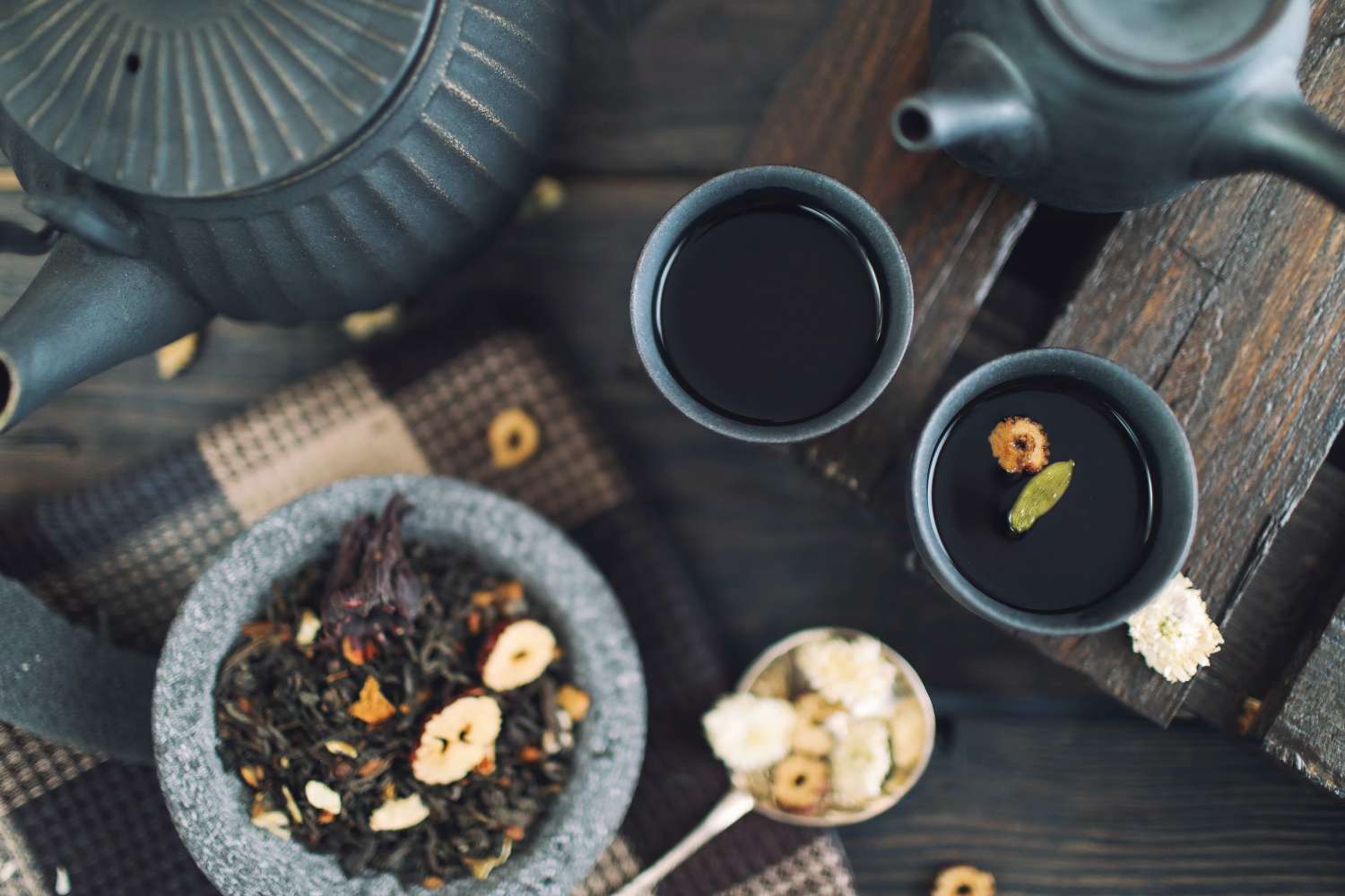 Bowls of organic dried herbs and whole spices